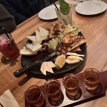 The State - Basil Bourbon Lemonade, Girl Next Door, Whisky Flight (Eagle Rare, Handcock Single Barrel, High West, Nikka Coffey Grain) and cheese plate. - Whiskey Bars Near Me - Monrovia, California The State - Basil Bourbon Lemonade, Girl Next Door, Whisky Flight (Eagle Rare, Handcock Single Barrel, High West, Nikka Coffey Grain) and cheese plate. - Whiskey Bars Near Me - Monrovia, California