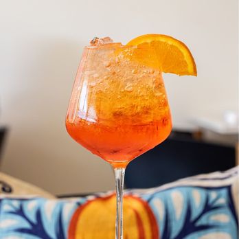 Limoncello - Nothing says "buon appetito" like a refreshing Aperol spritz and crispy calamari fritti - Italian Near Me - La Mesa, California