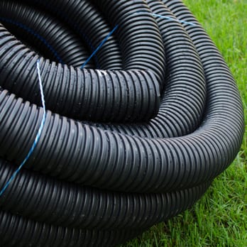 Miller Irrigation & Landscape Lighting - a black hose laying on the grass - Irrigation Near Me - Henrico, Virginia Miller Irrigation & Landscape Lighting - a black hose laying on the grass - Irrigation Near Me - Henrico, Virginia