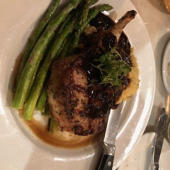 Nonni's Bistro - Pork Chop with Polenta and Asparagus with a lovely sauce at Nonni's Bistro. - Modern European Near Me - Pleasanton, California