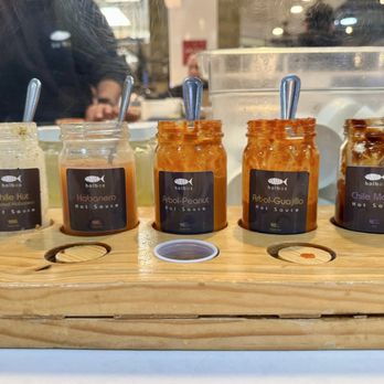 Holbox - House made sauces, with the most popular roasted habanero on the far left, and also the one with the most heat - Latin American Near Me - Los Angeles, California Holbox - House made sauces, with the most popular roasted habanero on the far left, and also the one with the most heat - Latin American Near Me - Los Angeles, California