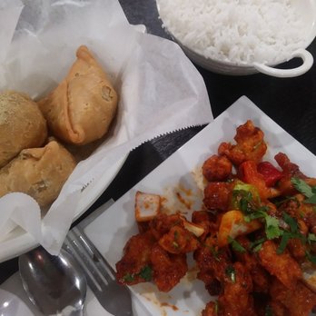 Sankranti - Gobi on bottom right ($6) Samosa on top left ($3) White rice ($2) - Indian Near Me - Sunnyvale, California Sankranti - Gobi on bottom right ($6) Samosa on top left ($3) White rice ($2) - Indian Near Me - Sunnyvale, California
