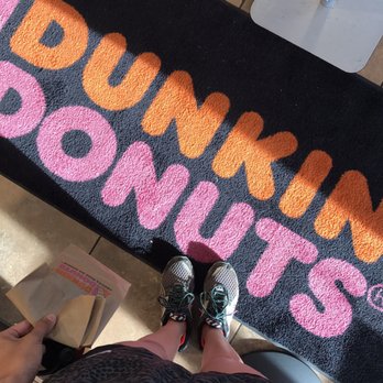 Dunkin' -  a person standing in front of a door mat - Donuts Near Me - Zephyrhills, Florida