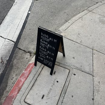 Garden Grill - a sidewalk with a sign on it - Barbeque Near Me - Los Angeles, California