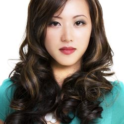 Salon Bravissimo - Long layered brunette haircut with voluminous curls, face-framing layers, and soft movement.