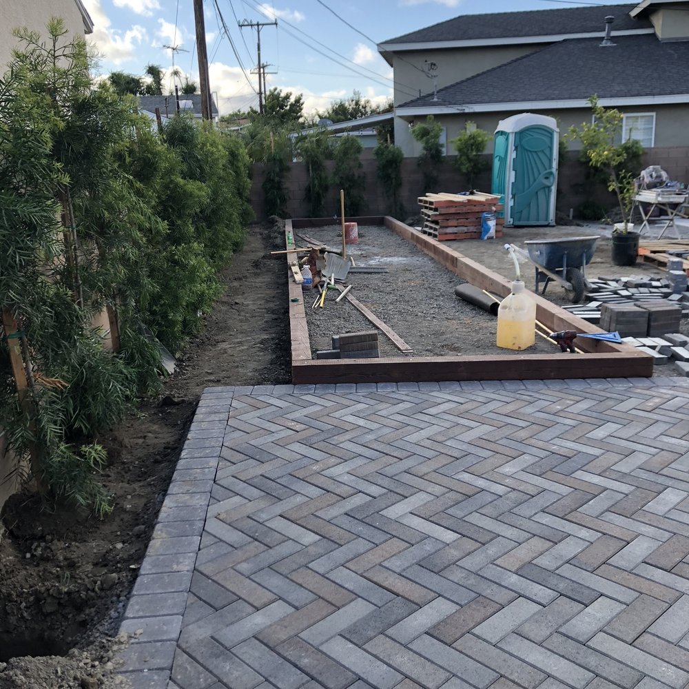 Pinewood Design - Installing the bocce ball court. - Landscaping Near Me - Long Beach, California Pinewood Design - Installing the bocce ball court. - Landscaping Near Me - Long Beach, California