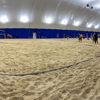 Woodland's Backyard - The volleyball dome has 6 courts and a makeshift bar inside. No bathroom, your ears pop, and the sand is icyyyyy cold. - Sports Bars Near Me - Columbus, Ohio