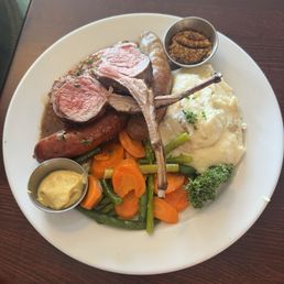 Mixed grill sampler with sausage, lamb and veal. Lamb was amazing!