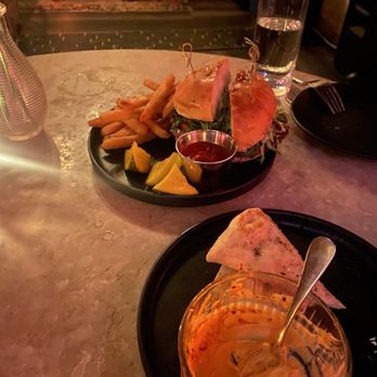 Devil May Care - Hummus (or what's left of it) and a burger. - Lounges Near Me - Austin, Texas
