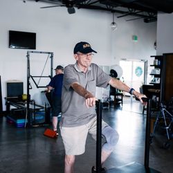 FIT Physical Therapy - Patient using physical therapy equipment.