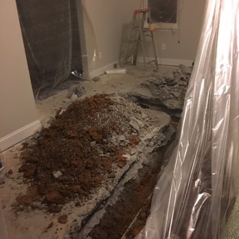 McKee Homes - The trench in the middle of our living room caused by the pipe installed too high. As you can see a very poor job of covering our items. - Home Developers Near Me - Raleigh, North Carolina McKee Homes - The trench in the middle of our living room caused by the pipe installed too high. As you can see a very poor job of covering our items. - Home Developers Near Me - Raleigh, North Carolina