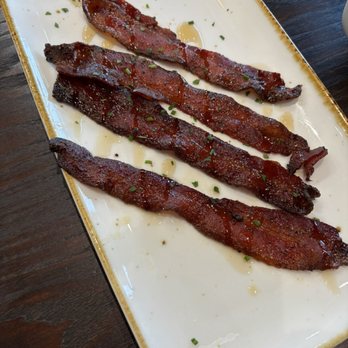 First Watch - Million dollar bacon - smoked bacon baked with brown sugar, black pepper, cayenne and maple syrup drizzle - Juice Bars & Smoothies Near Me - Meridian, Idaho First Watch - Million dollar bacon - smoked bacon baked with brown sugar, black pepper, cayenne and maple syrup drizzle - Juice Bars & Smoothies Near Me - Meridian, Idaho