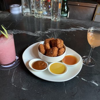 Trick Dog - Drinks: Moccasin (L) and Funk Living from the "The Whole Dog Menu." Food: chicken nuggets with fancy condiments - Cocktail Bars Near Me - San Francisco, California Trick Dog - Drinks: Moccasin (L) and Funk Living from the "The Whole Dog Menu." Food: chicken nuggets with fancy condiments - Cocktail Bars Near Me - San Francisco, California