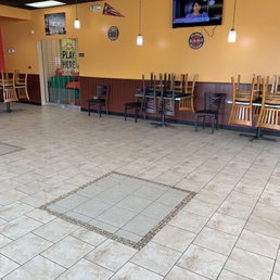 an empty restaurant with chairs and tables an empty restaurant with chairs and tables
