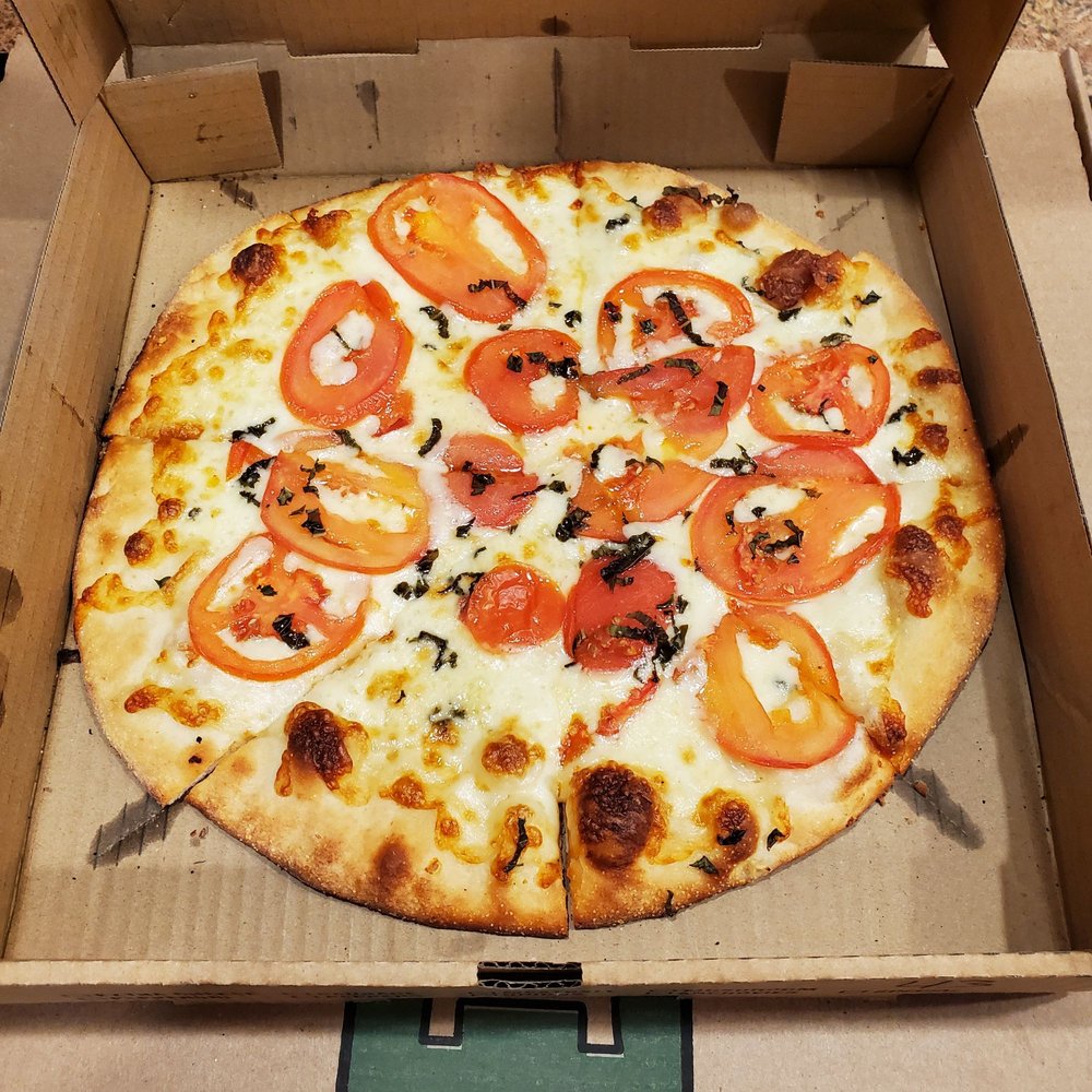 The Plum Tomato Logo