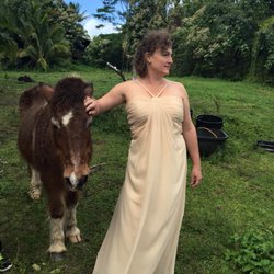 Sally B Boyd, ND - Sally in her wedding dress with her favorite pony