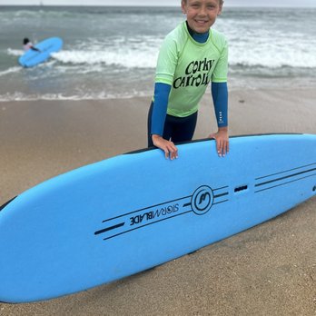 Corky Carroll's Surf School - Surf board and wetsuit included for a camp - Surfing Near Me - Huntington Beach, California