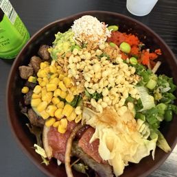 Rice, salad, tuna sashimi , beef teriyaki, corn, ginger, green onions, crab, roe, fried age, and a little spice sauce. Rice, salad, tuna sashimi , beef teriyaki, corn, ginger, green onions, crab, roe, fried age, and a little spice sauce.