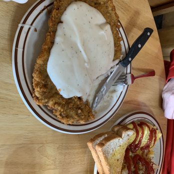 Trails Inn Restaurant - Chicken fries steak and gravy breakfast. Not shown: eggs and hash browns next to it. - American Near Me - Ashton, Idaho Trails Inn Restaurant - Chicken fries steak and gravy breakfast. Not shown: eggs and hash browns next to it. - American Near Me - Ashton, Idaho