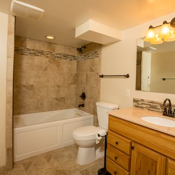 Fry Construction & Remodeling - Bathroom remodel.  Tiled tub surround and vanity backsplash.  Heated tile floor. - General Contractors Near Me