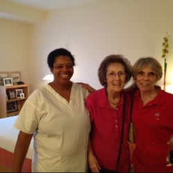 A Move Made Easy - Staff member, right, proudly shows off the finished studio to client & her aide. Everyone wears smiles because of how beautiful it looks.