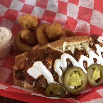Serious Dogs - The Tom Dog - chili, pepperjack cheese, sour cream, jalapeños! - Hot Dogs Near Me - Battle Creek, Michigan Serious Dogs - The Tom Dog - chili, pepperjack cheese, sour cream, jalapeños! - Hot Dogs Near Me - Battle Creek, Michigan