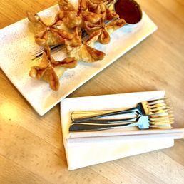 the Blue Crab Rangoon, a Chinese-American fusion filled with crab stick, scallions, cream cheese, and served with a sweet sauce. A must! the Blue Crab Rangoon, a Chinese-American fusion filled with crab stick, scallions, cream cheese, and served with a sweet sauce. A must!