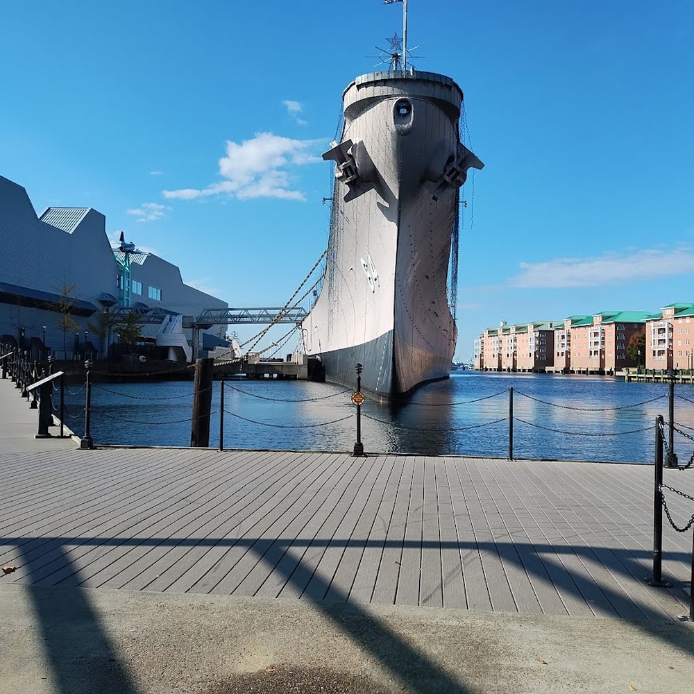 Nauticus - Front view of the Nauticus Museum and USS Wisconsin museum navy ship exhibit Norfolk Virginia - Museums Near Me - Norfolk, Virginia Nauticus - Front view of the Nauticus Museum and USS Wisconsin museum navy ship exhibit Norfolk Virginia - Museums Near Me - Norfolk, Virginia