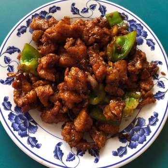 QQ China - a plate of food on a table - Chinese Near Me - Taylorville, Illinois QQ China - a plate of food on a table - Chinese Near Me - Taylorville, Illinois