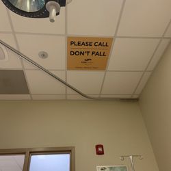 SSM Health St Clare Hospital - Sign on ceiling of operating room says:  "PLEASE DON'T FALL". Ironic? Nah !  They know.