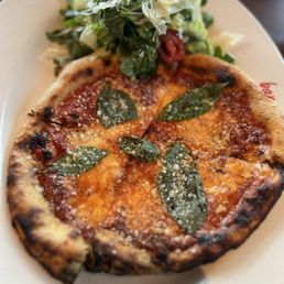 Lunch margarita pizza and simple green salad Lunch margarita pizza and simple green salad
