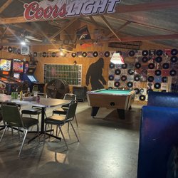 Dew Drop Inn - Sweet decor with arcade games, pool, and vinyl records lining the entire wall.