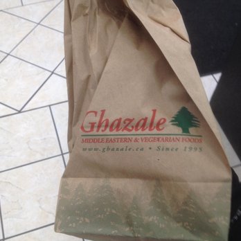 Ghazale - a person holding a brown paper bag - Middle Eastern Near Me - Toronto, Ontario Ghazale - a person holding a brown paper bag - Middle Eastern Near Me - Toronto, Ontario