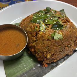 Kothu Parotta as is without additions served with Salna. Highest spice. Veg, dairy free and egg free.