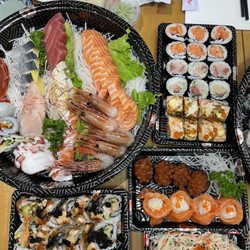 803 assorted sashimi, 401 sake hosomaki, 405 hamachi hosomaki, ikura sushi, salmon rose, kani salad, black dragon roll