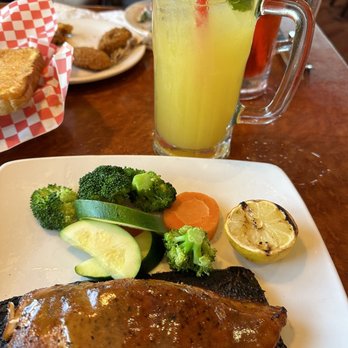 Sizzler - cedar plank salmon topped with ginger soy sauce , vegetable medley , and mango lemonade - Seafood Near Me - Manteca, California