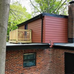 All States Roofing Contractors - Custom flat roof system with rooftop deck and integrated drainage, designed for performance and modern aesthetics.
