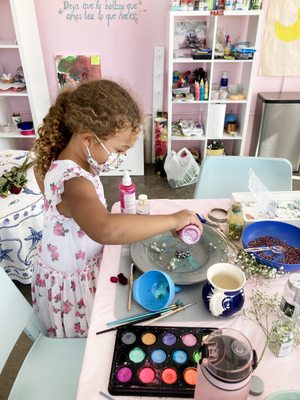 Children's Art Classes - In our children's art classes we encourage your young artist to expand their imagination and follow their inspiration. In addition to the instructional focus of their specific class, we provide your child with the art supplies, materials, and support to artistically go wherever their creativity leads them - even if it is beyond the particular technique of that class. Offerings include: Sparkle Art, Potion Making, Painting on Canvas, Watercolors, Easel Painting, Sewing, Flower Art, and many others! Children's Art Classes - In our children's art classes we encourage your young artist to expand their imagination and follow their inspiration. In addition to the instructional focus of their specific class, we provide your child with the art supplies, materials, and support to artistically go wherever their creativity leads them - even if it is beyond the particular technique of that class. Offerings include: Sparkle Art, Potion Making, Painting on Canvas, Watercolors, Easel Painting, Sewing, Flower Art, and many others!