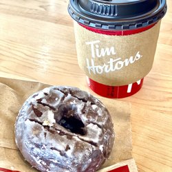 Tim Hortons - Chocolate glazed donut and a small coffee.