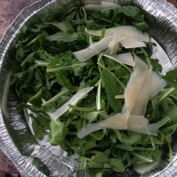 Wilted arugula. Few swipes of soggy cheese......7$ salad it is not