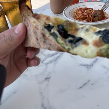 Pizzeria Ruby - Half of a specialty white slice. - Italian Near Me - Springdale, Arkansas