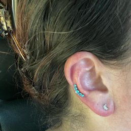 Helix and lobe piercings. Helix and lobe piercings.