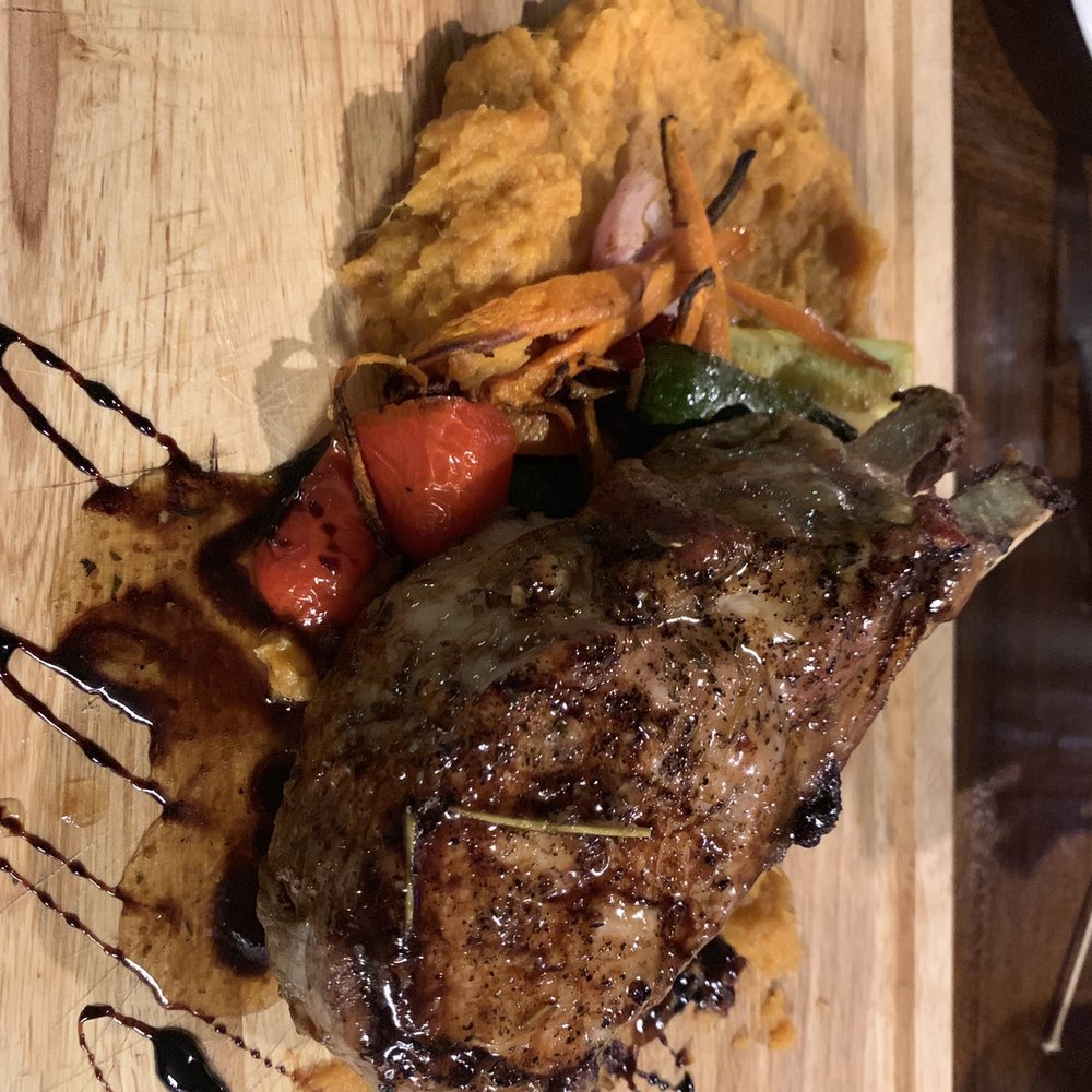 Harps Of Trinity - Drool worthy huge doubled boned pork chop! - Irish Pub Near Me - Trinity, Florida