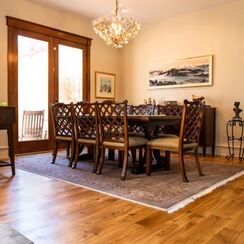 Supreme Hardwood Floors - a dining room with a chandelier - Flooring Near Me - Austin, Texas Supreme Hardwood Floors - a dining room with a chandelier - Flooring Near Me - Austin, Texas