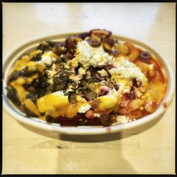 EONS Stix - Custom bowl with steak, gîtante beans, beet salad, additional veggies, garlic spread, and hot sauce