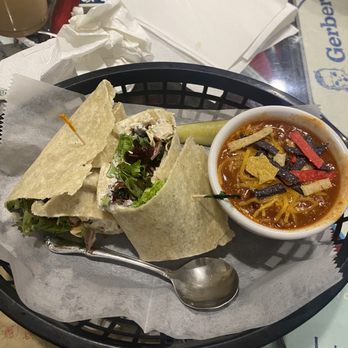 Koffee Kuppe Cafe - Chicken salad on a gluten free wrap with their gluten free chili and topped with corn tortilla chips - Coffee & Tea Near Me - Fremont, Michigan Koffee Kuppe Cafe - Chicken salad on a gluten free wrap with their gluten free chili and topped with corn tortilla chips - Coffee & Tea Near Me - Fremont, Michigan