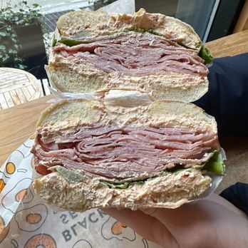 Black Seed Bagels - Hot honey cream cheese, lettuce, and ham on a plain bagel - Breakfast & Brunch Near Me - New York, New York Black Seed Bagels - Hot honey cream cheese, lettuce, and ham on a plain bagel - Breakfast & Brunch Near Me - New York, New York