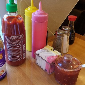 Egg Roll Number 1 - All condiments at the table - Vietnamese Near Me - Indianapolis, Indiana Egg Roll Number 1 - All condiments at the table - Vietnamese Near Me - Indianapolis, Indiana