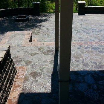 Environmental Landscape Management - a patio with a fire pit - Landscaping Near Me - Hudson, Wisconsin Environmental Landscape Management - a patio with a fire pit - Landscaping Near Me - Hudson, Wisconsin
