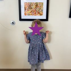 Imagine Preschool - Proud artist with her piece (Year 1)